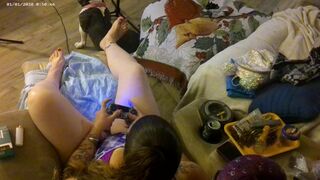 Roommate stands over me from behind and films down my blouse while I smoke and play video games