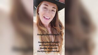 Naked redhead outside on farm