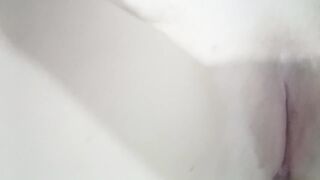 Wet petite girl touching herself in front of the mirror