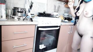 Hairy brunette milf, big tits, sensual hairy woman in the kitchen.
